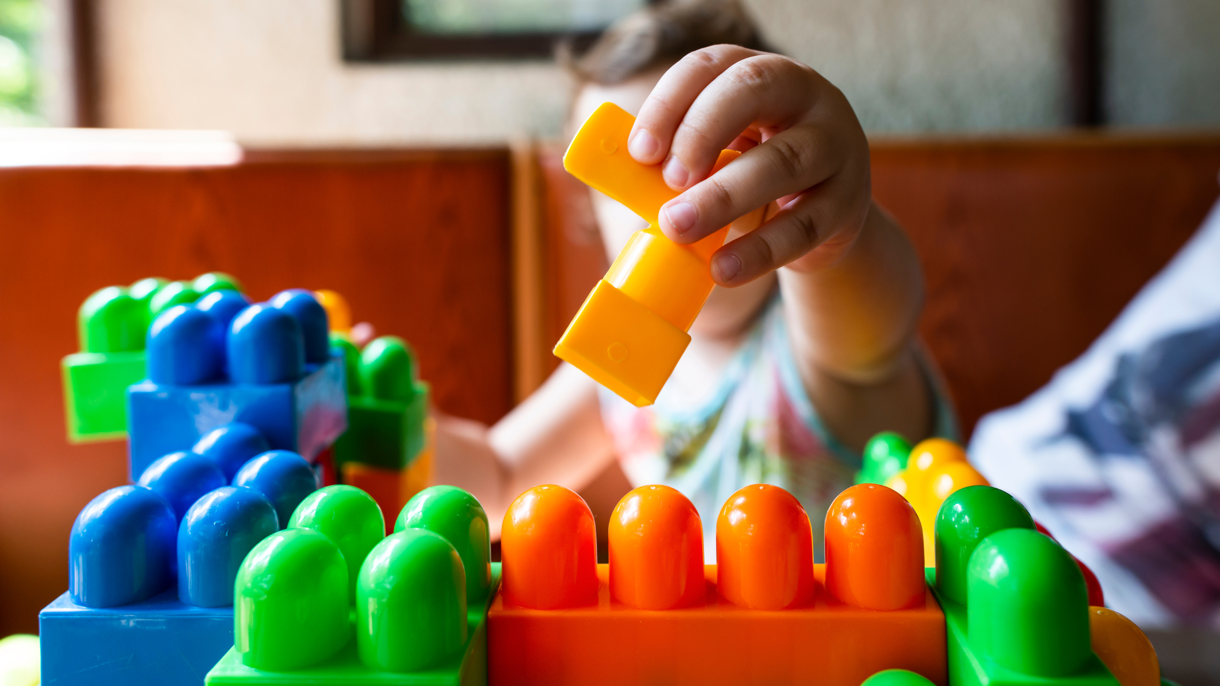 Small child playing with blocks